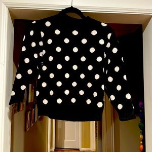 Joie sweater. Black sweater with cream polka dots. Reverse patter inside.